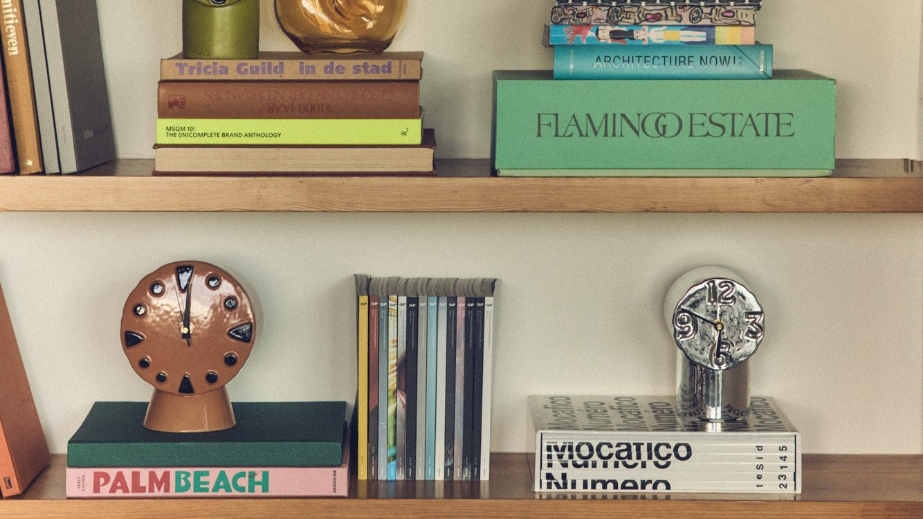 book case with books and ceramic clocks