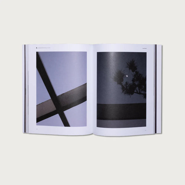 Open book showing two black and white photographs on a light gray background