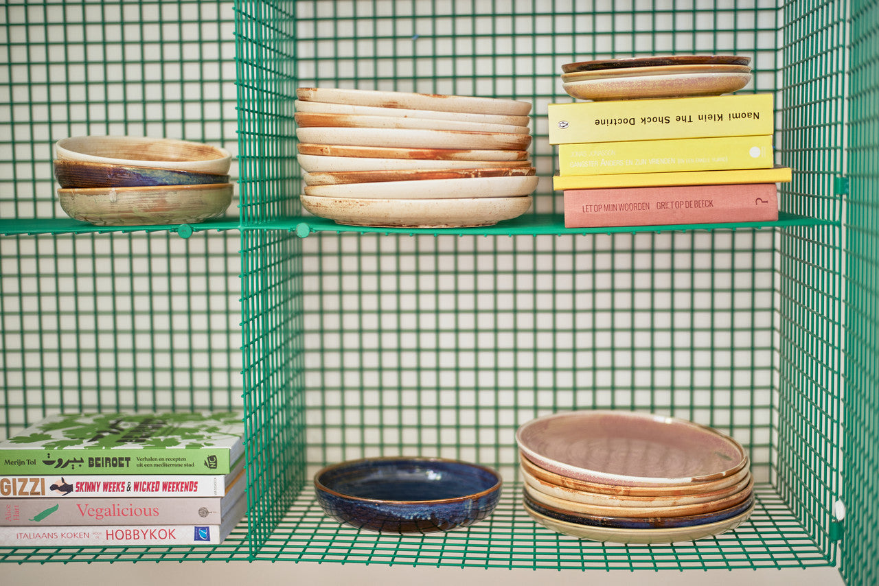 porcelain rustic blue deep plate in green open shelving