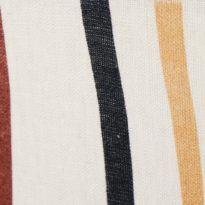 detail of large floor lamp with ceramic cone shaped cream base and linen shade with maroon black and yellow swirls