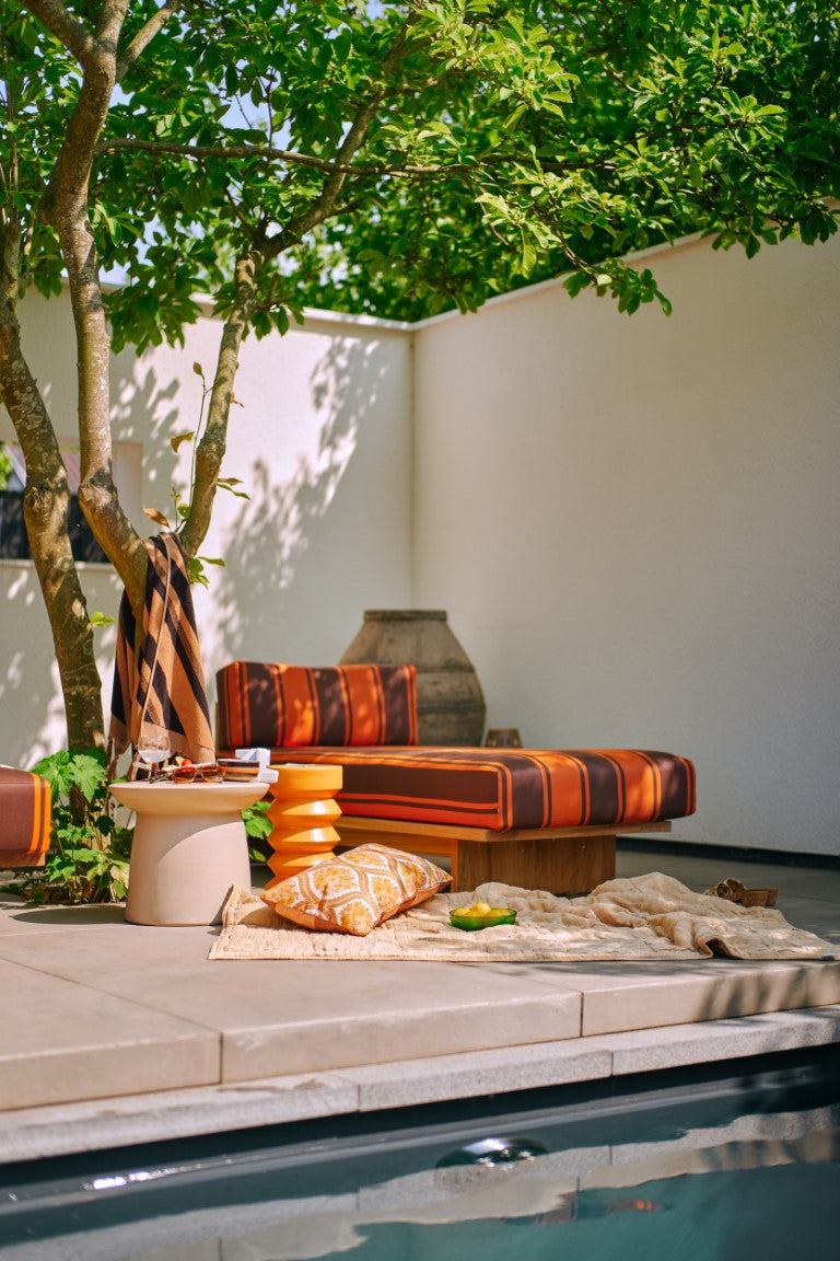 sculpture like earthenware accent table poolside with terracotta accent table and outdoor daybed