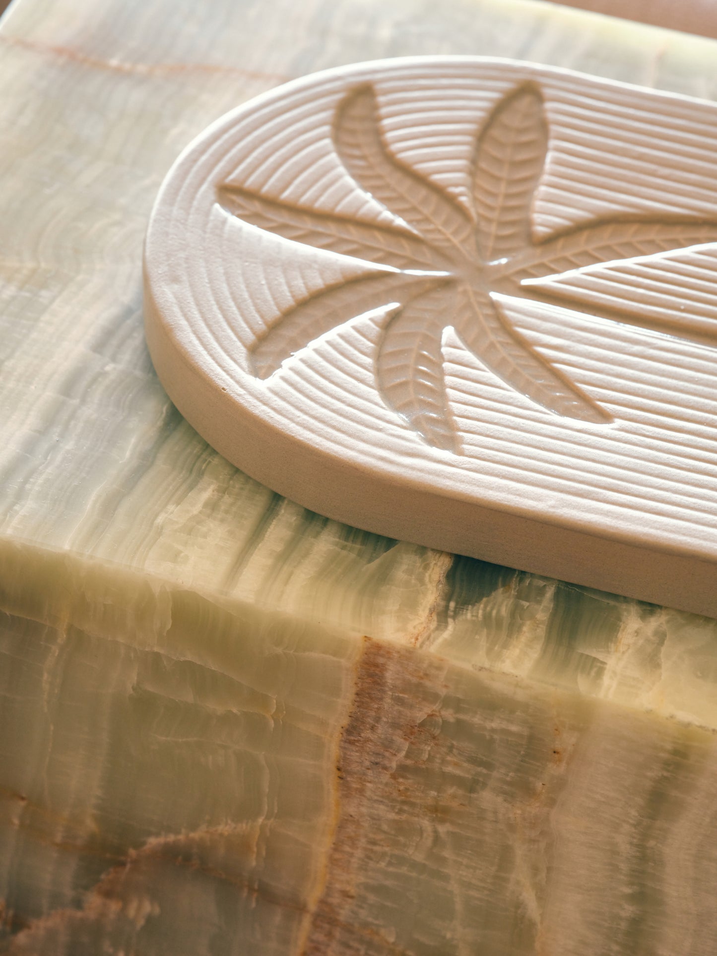 cream earthenware wall tile with palm tree