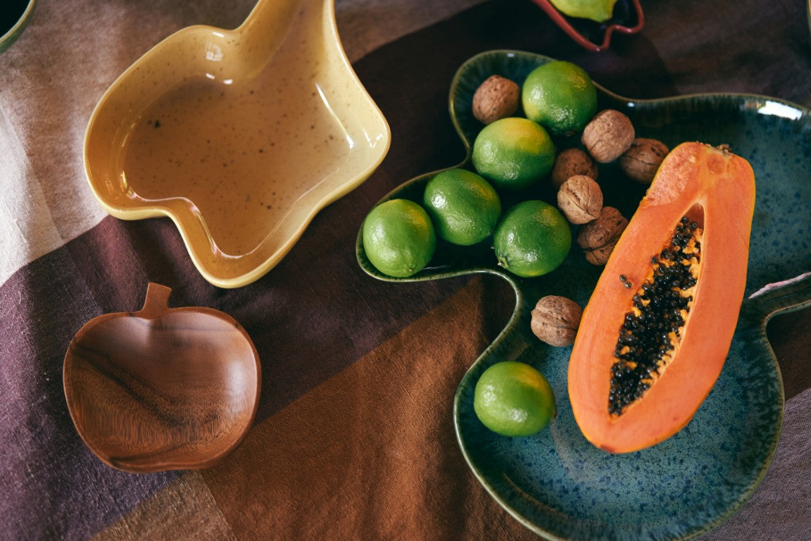 yellow speckled freestyle stoneware bowl on table