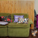 green sofa with retro accent pillows