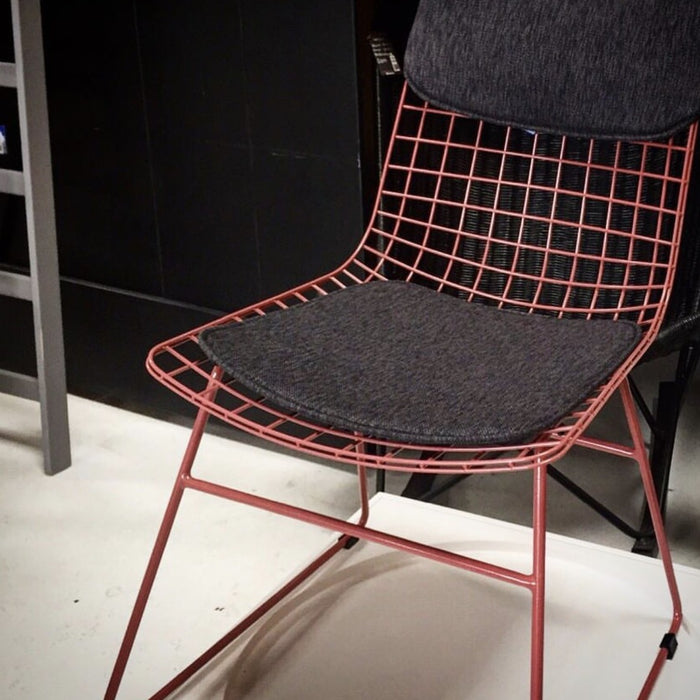 Detail of metal wire chair in marsala with comfort kit in charcoal