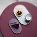 gallery ceramics in pastel colors on purple table 