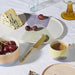 oval shaped dinner plate with cheese and grapes
