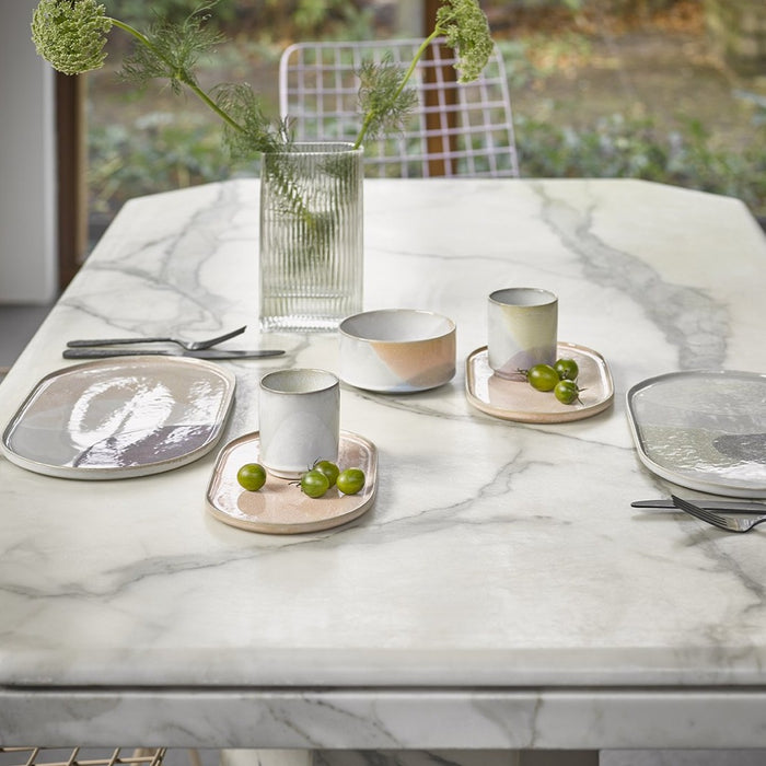 marble table top with ceramics in pastel colors