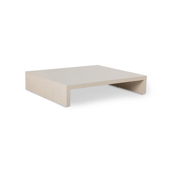 sand colored wooden plateau table