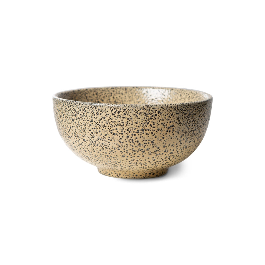 bowl in peach color with dark speckles