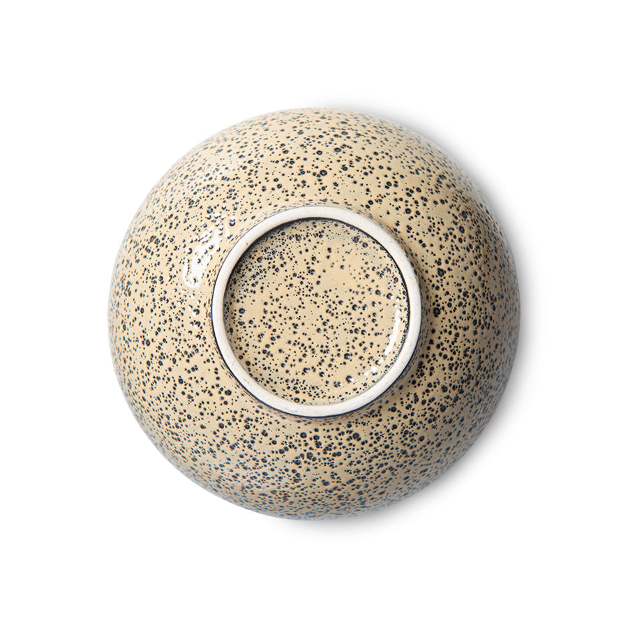 stoneware bowl in peach color with dark speckles