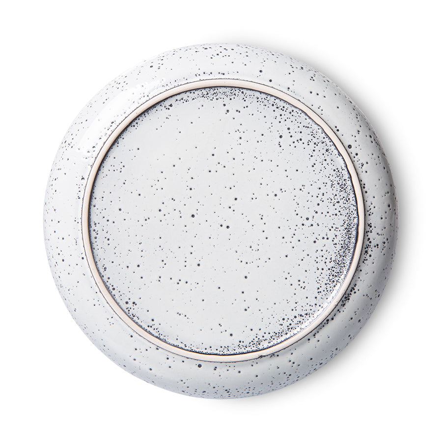 back of a round stoneware speckled deep plate