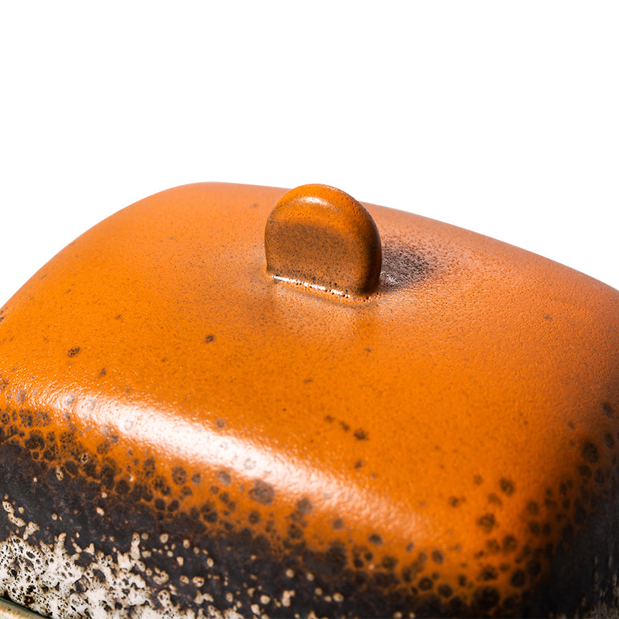 retro style stoneware butterdish in orange brown and green