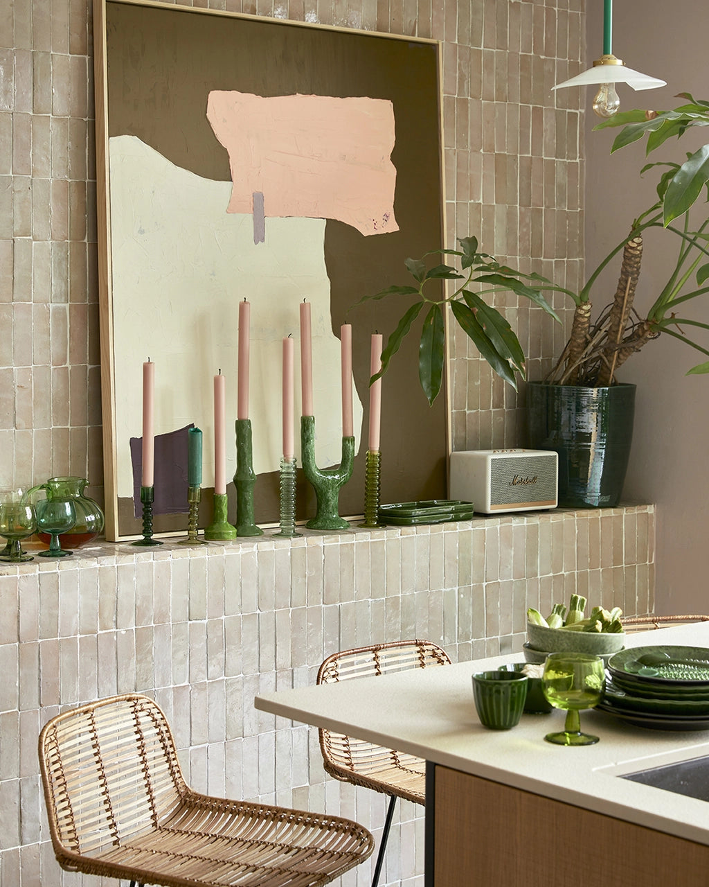 kitchen in beige and blush colors with green colored glassware