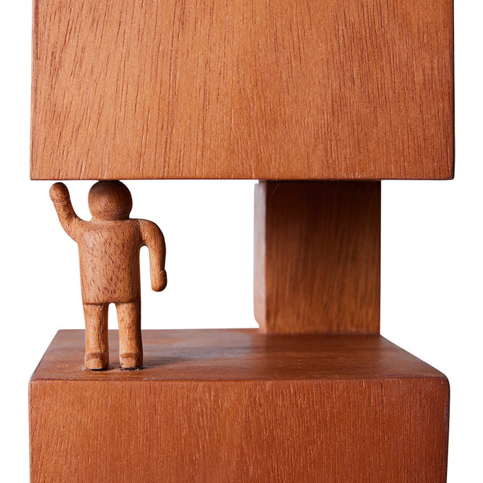 detail of mahogany wooden sculpture with hand carved figurine