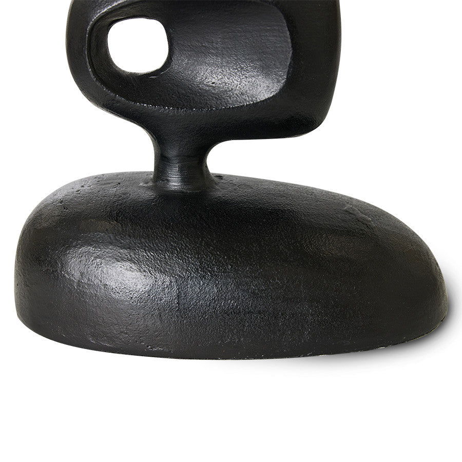 detail of tall black aluminum handmade sculpture