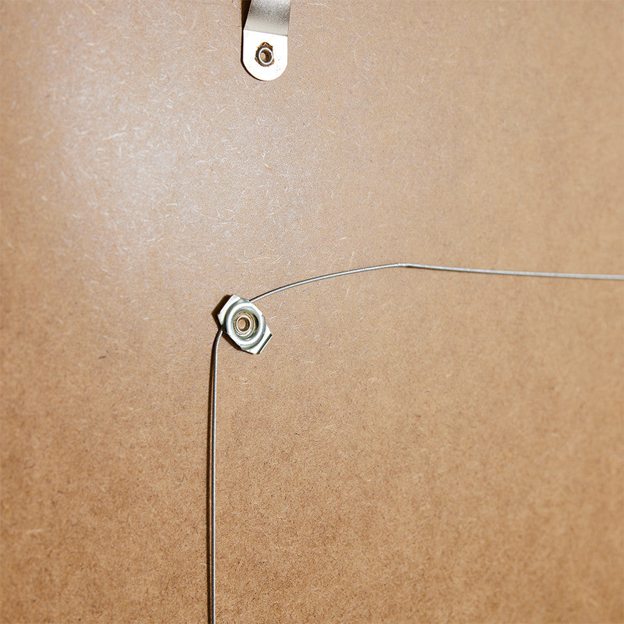 detail of back loader from wooden art frame