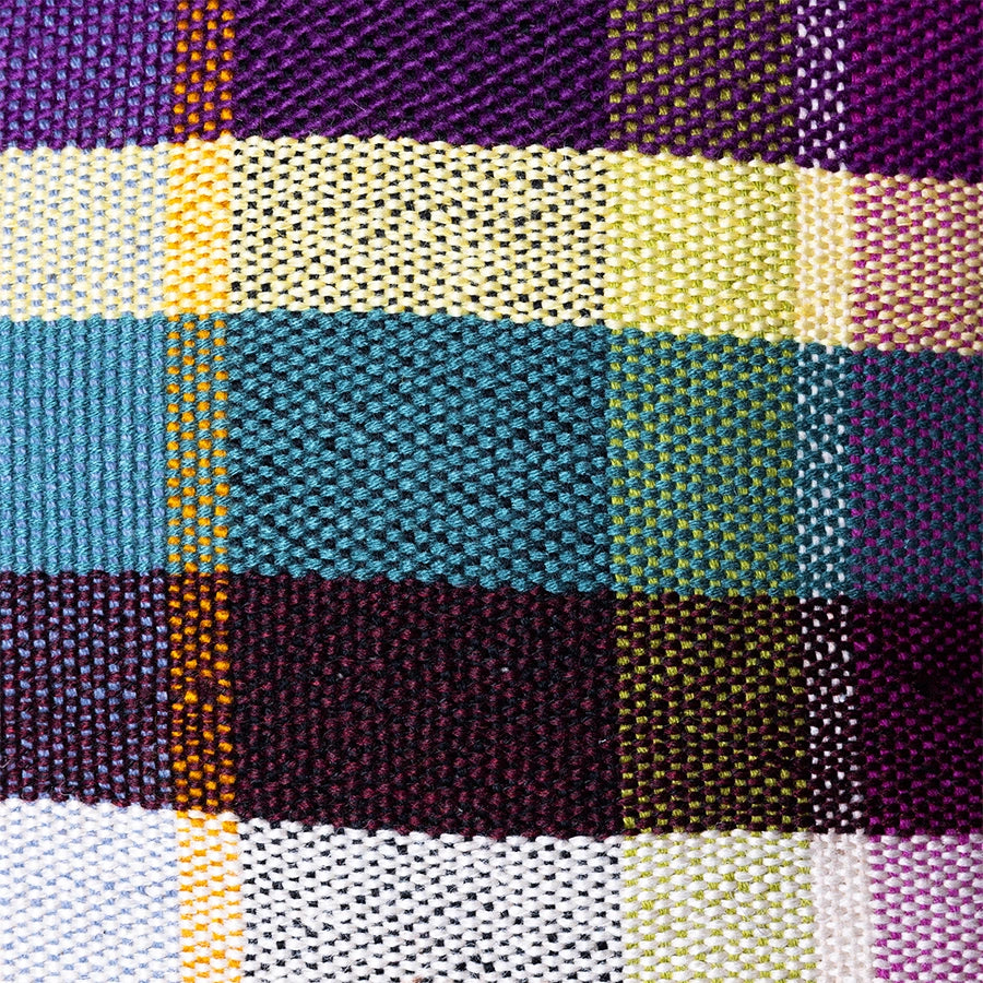 detail of multicolored cotton retro style throw pillow