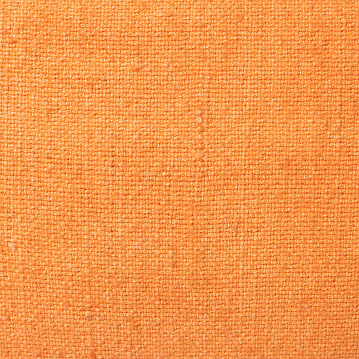 detail of the linen of orange linen lumbar pillow with brown cotton trim