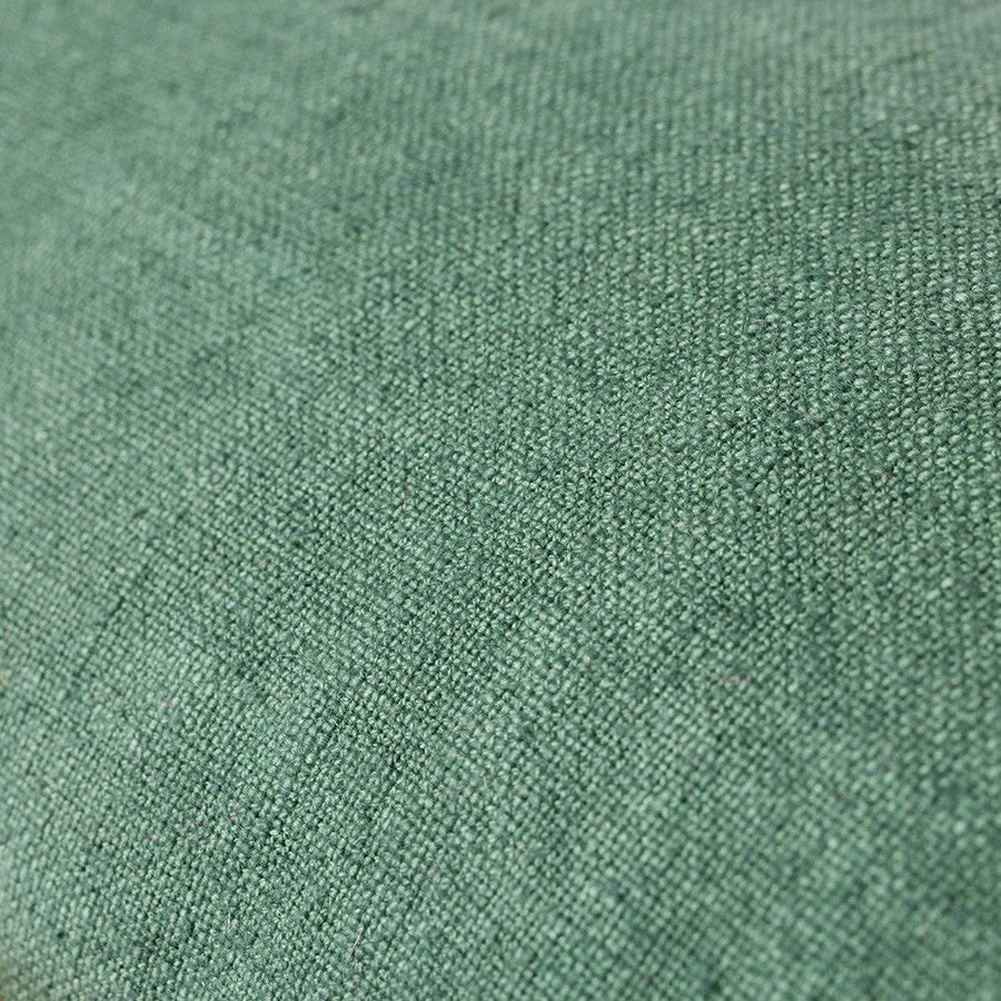 close up of green linen fabric