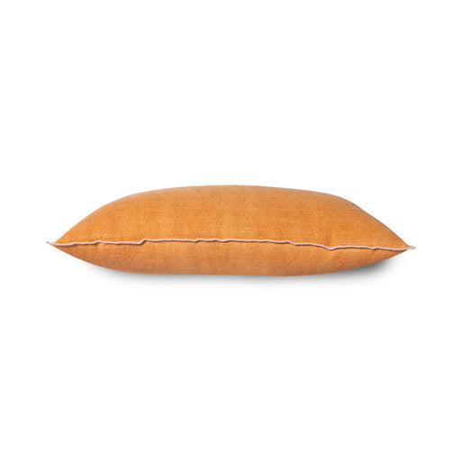 lumbar shape orange linen pillow with a blush colored cotton trim