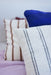 detail of natural cotton thin striped super large pillow on bed
