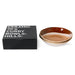 black box and two stoneware curry bowls with orange and terra colored finish