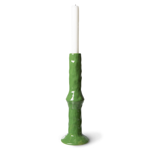 tall green candle stick holder with white candle