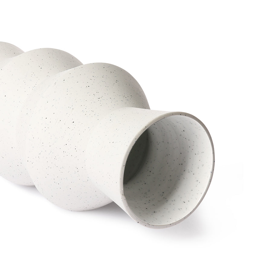 opening of white angular shaped vase