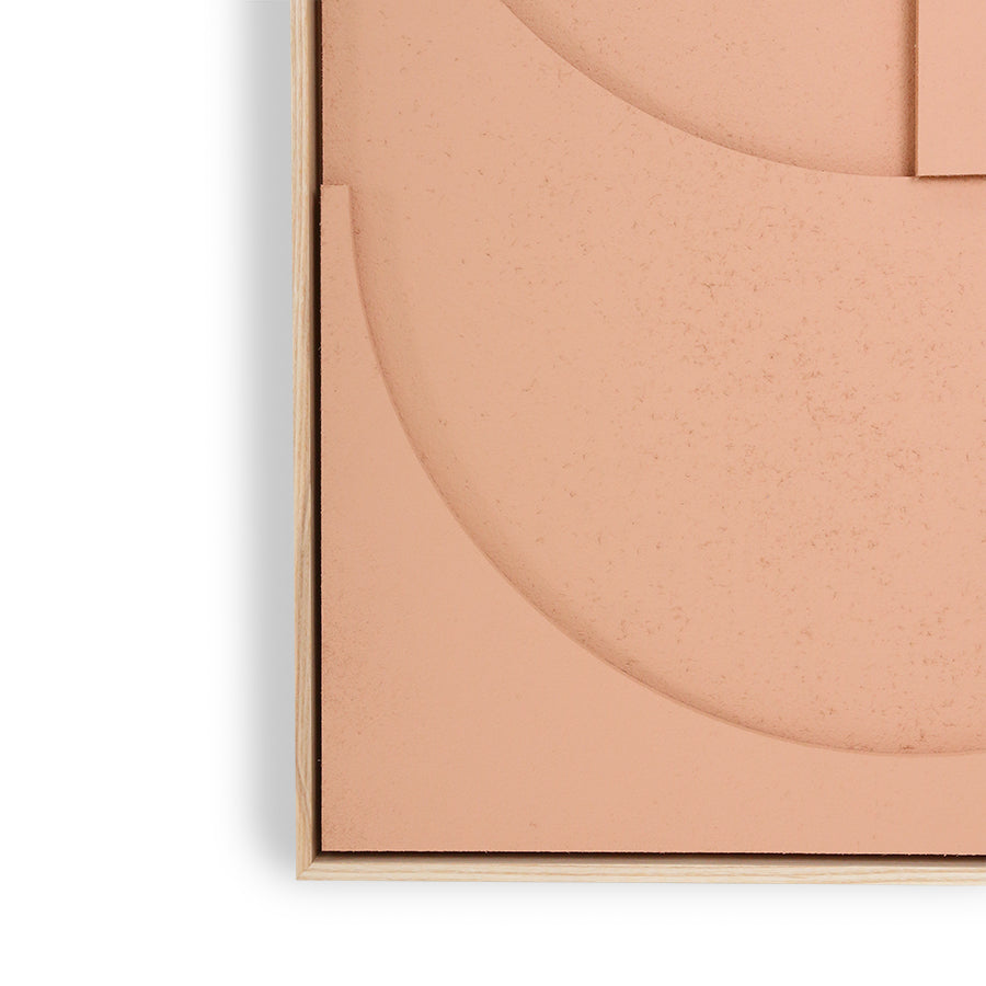 detail of felt and peach colored paint with frame