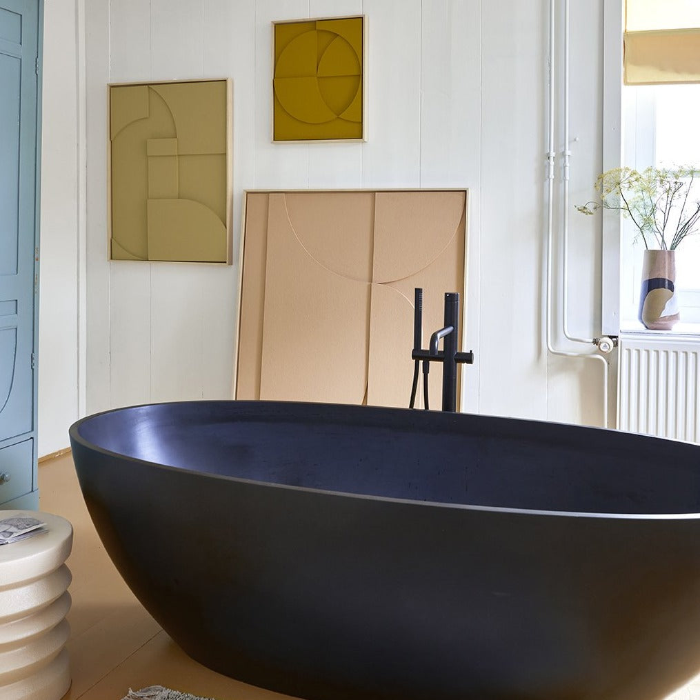 modern bathroom with large, peach colored acoustic art relief panel