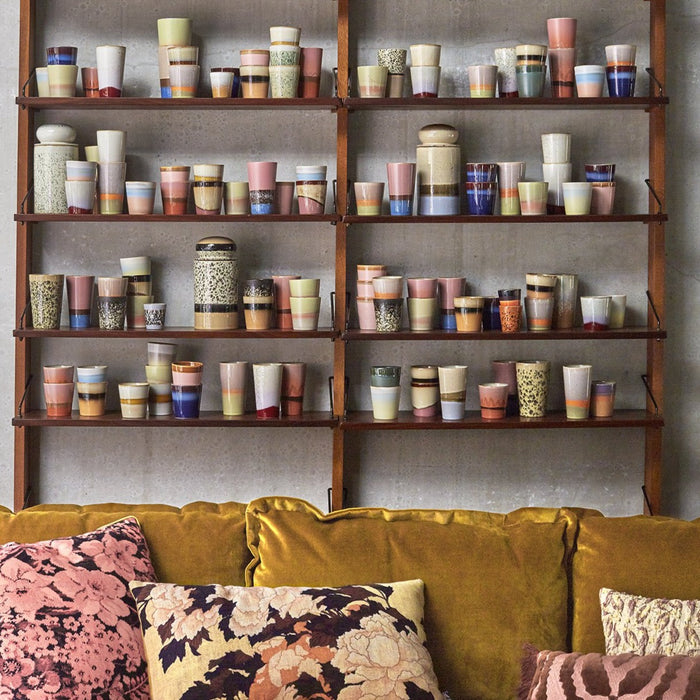 open shelving filled with a collection of HKliving USA ceramic mugs and storage jars