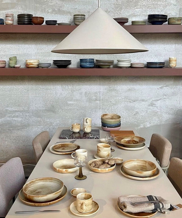 table setting with cream and brown dinnerware