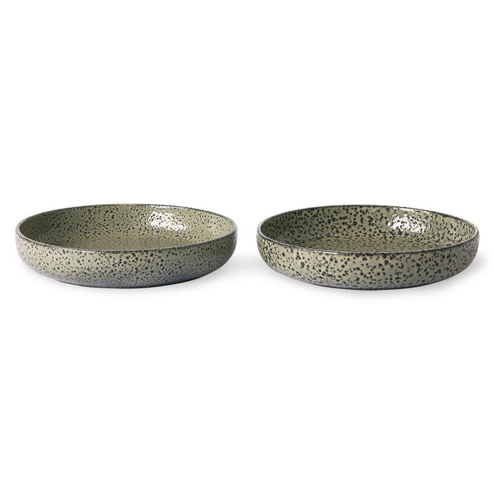 two deep plates made from green speckled stonware