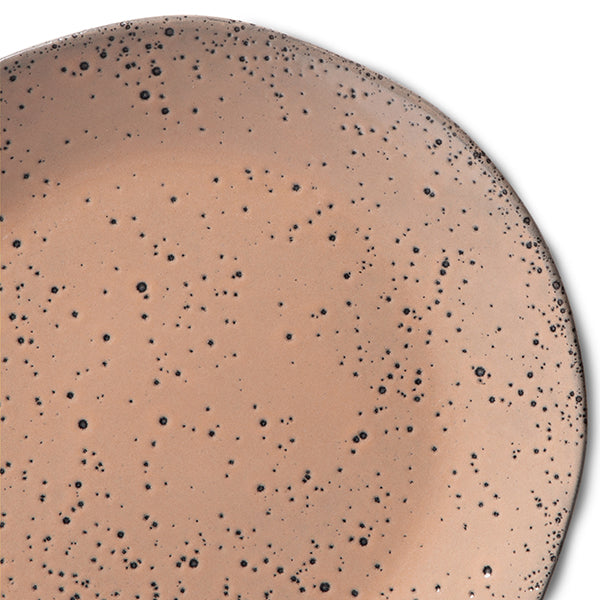 close up of reactive glazed and speckled taupe color appetizer plate