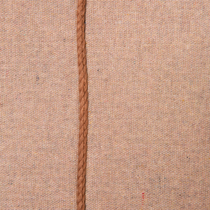 detail of brown stiches on cotton