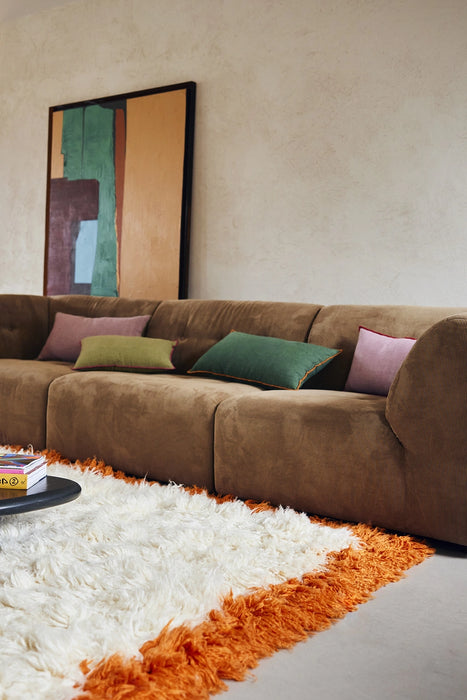 brown corduroy element couch with linen pillows in green and pink with contrasting trims