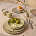 gradient ceramics table setting with yellow plates and tumbler mugs