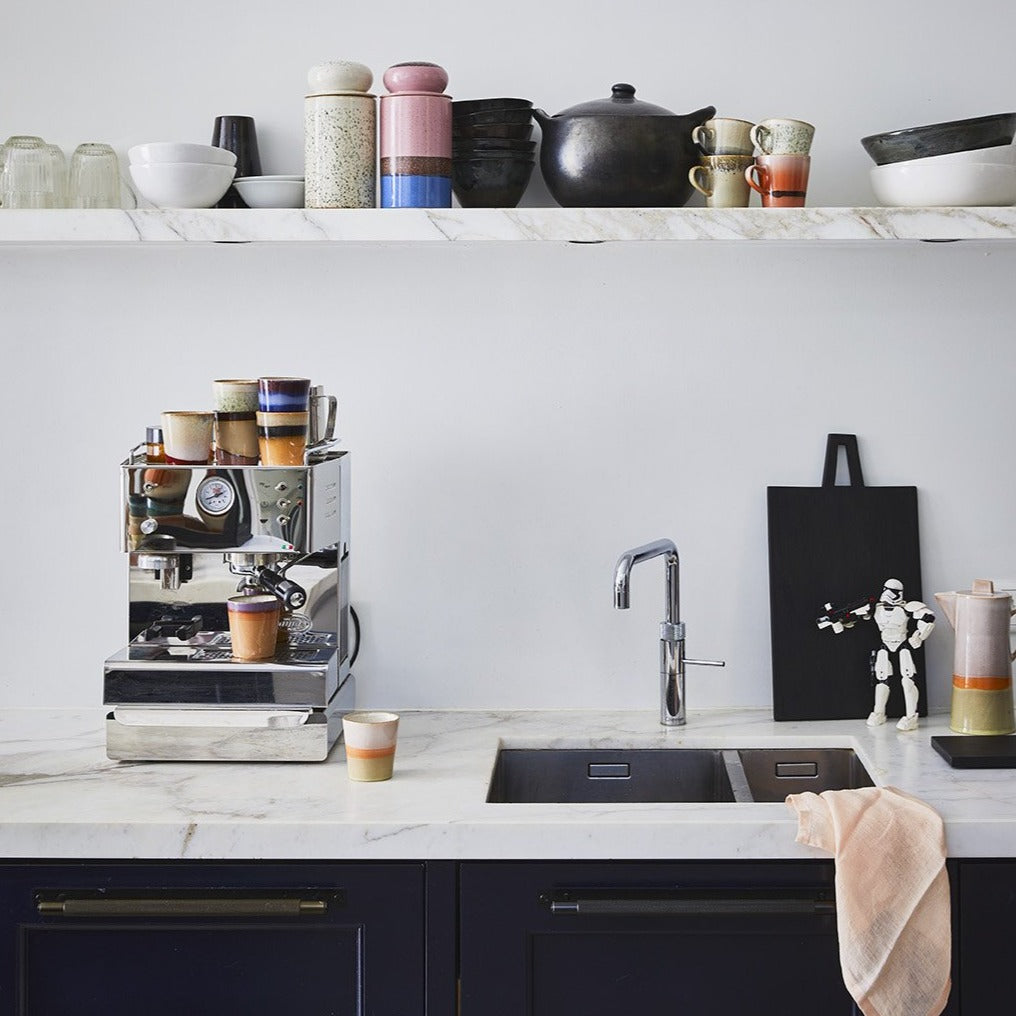 kitchen with open shelving and tow storage jars with lids