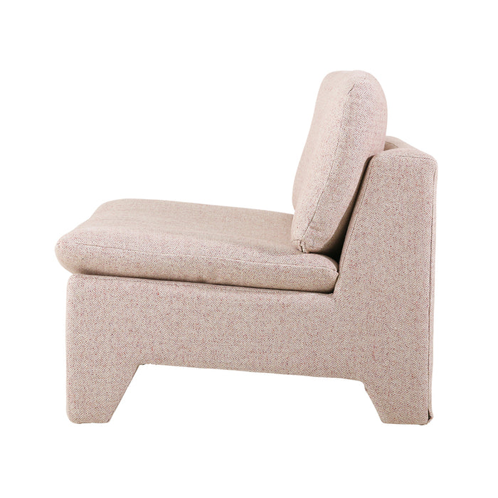 lounge chair with pink boucle fabric in a 1970's style design