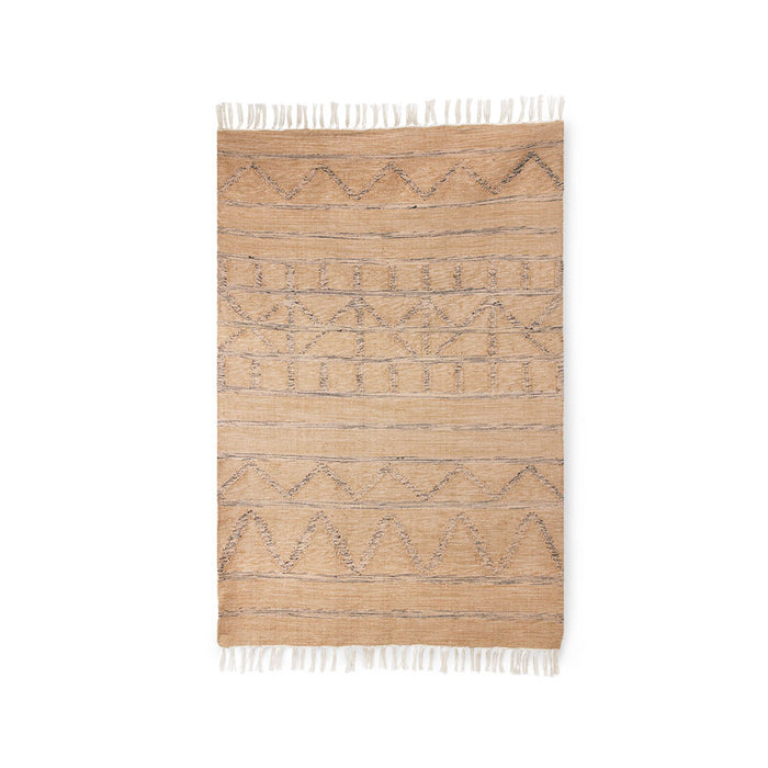 neutral colored rug with graphic pattern and fringes