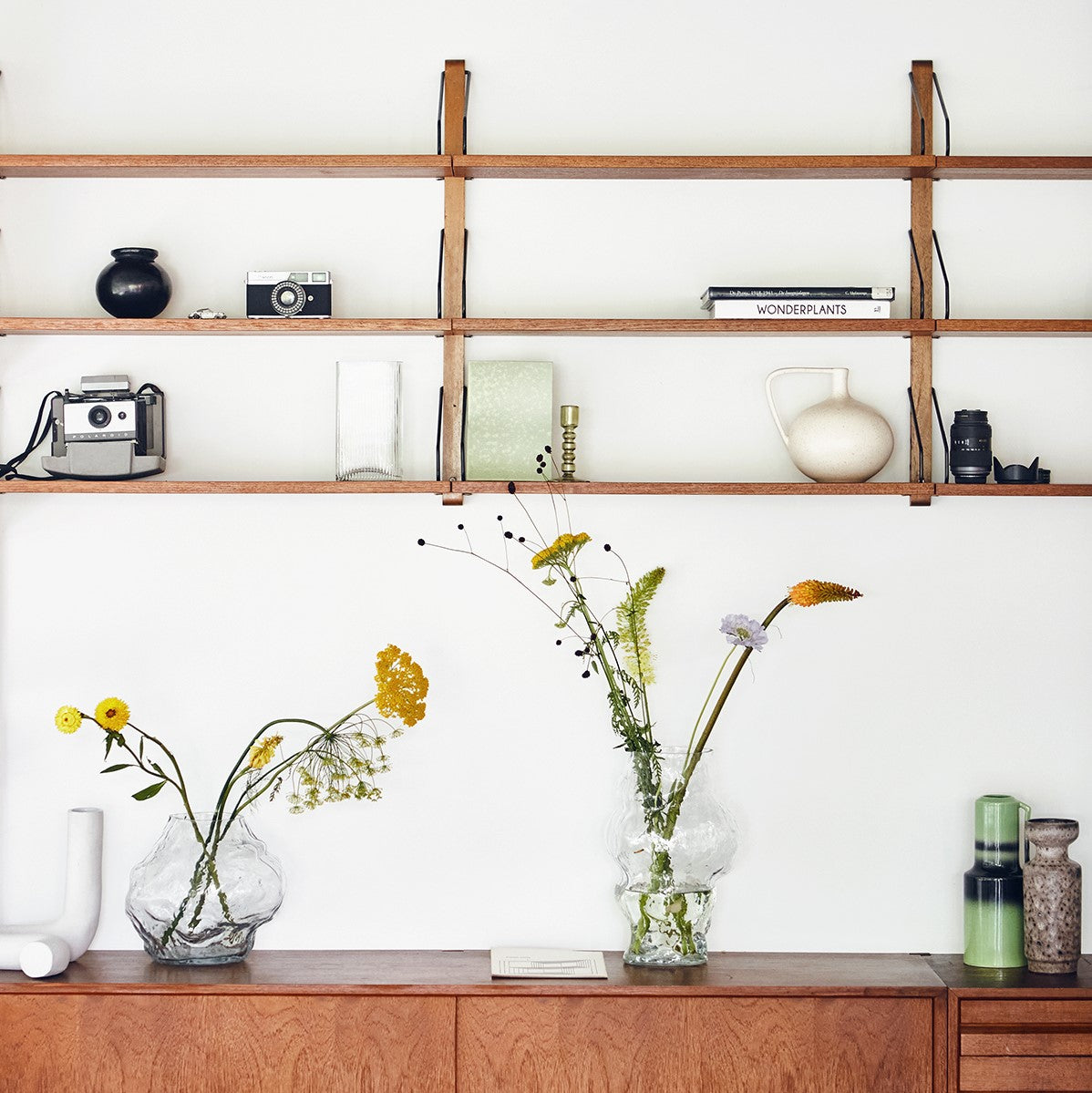 open shelving with clear glass cloud vases