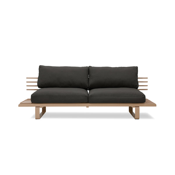 chai colored outdoor sofa with black seating cushions