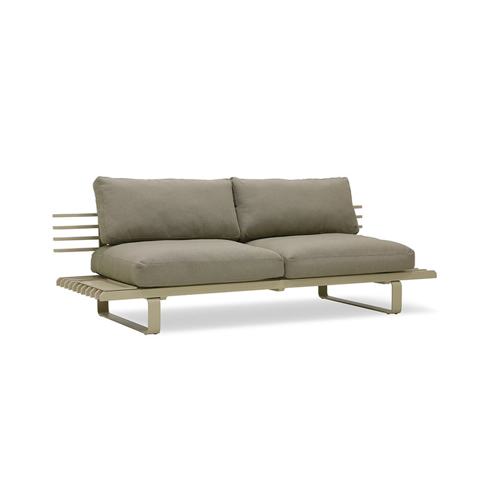 olive green outdoor sofa with beige pillows