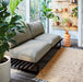 patio with aluminum sofa in charcoal and a neutral rug with graphics  