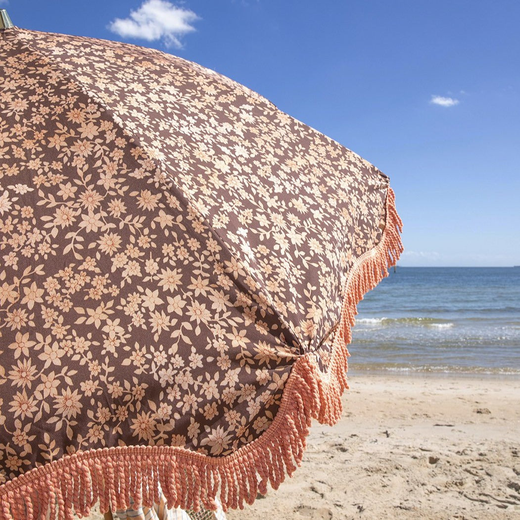 close up of retro style beach umbrella with fringes