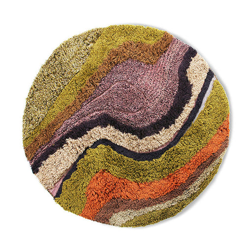 gradient round rug made from hand tufted wool in warm muted colors like green, terracotta, mustard yellow and purple