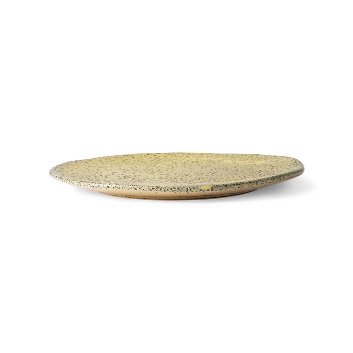 side view of organic shaped yellow plate