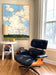 large painting and striped table lamp with Eames chair