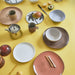 table setting with multi colored ceramics
